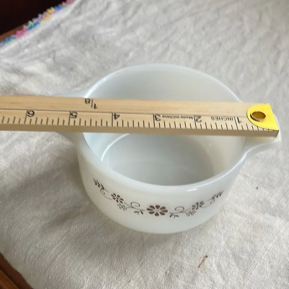Vintage brown Daisy Dynaware Pyr-O-Rey casserole dish.
